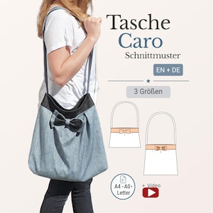 May include: A light blue denim tote bag with a black bow and strap. The bag has a black top and is being carried by a person. The text "Tasche Caro Schnittmuster" is visible.