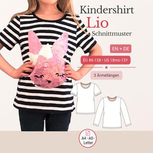 May include: A black and white striped t-shirt with a pink sequined bunny design. The shirt has short sleeves and is part of a sewing pattern called "Kindershirt Lio". The pattern includes sizes for children aged 18 months to 13 years.