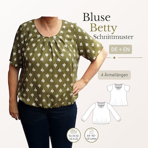 Peut inclure: Chemisier vert olive avec un motif floral blanc. Le chemisier a des manches courtes et un col rond. Le texte "Bluse Betty Schnittmuster" est visible. Comprend des informations de taille EU 34-50 et US 4-20.