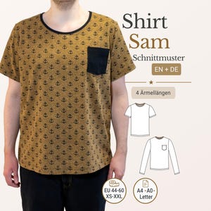 May include: Mustard-colored shirt with a black anchor pattern and a black pocket. The shirt has a black neckline and short sleeves. Text on the image reads "Shirt Sam Schnittmuster EN + DE" and sizing information.