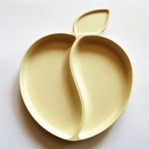 Bamboo plate for children, ecological feeding plate or decorative plate made of bamboo in apple shape.