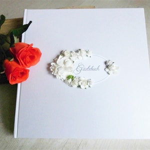 Wedding guest book with pen and holder in white and gold image 1