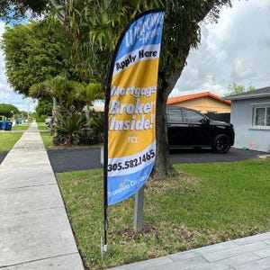 Feather flag on ground stake.