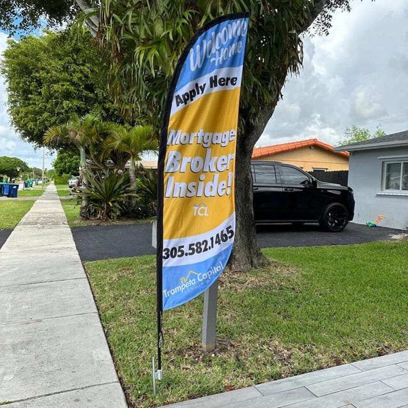 Feather flag on ground stake.