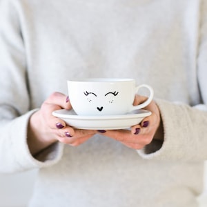 Face decor tea cup, coffee lover funny accessories, modern white porcelain with gold decor, 250 ml cup with a saucer - black SMILEY FACE