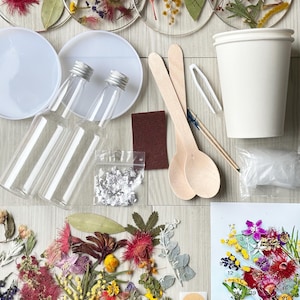 May include: A resin art kit with everything you need to create your own coasters. The kit includes four clear resin coasters, two bottles of resin, a cup of glitter, a sanding block, two wooden stirring sticks, a pair of tweezers, a wooden spoon, a toothpick, a bag of dried flowers, and two stickers that say "Hand Made".