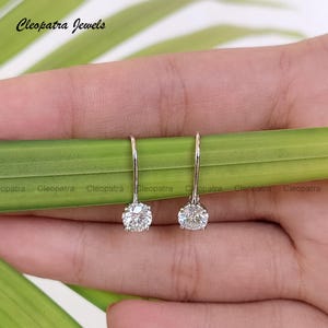 Moissanite Stud Earrings: 950 Platinum Round Brilliant Cut