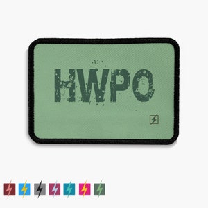 May include: A green patch with black stitching and the text "HWPO" in a distressed font. A small lightning bolt symbol is in the bottom right corner.
