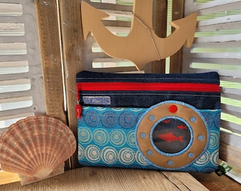 Cosmetic bag with porthole and fish