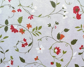 Coated cotton flowers red beige green (sold by the metre)