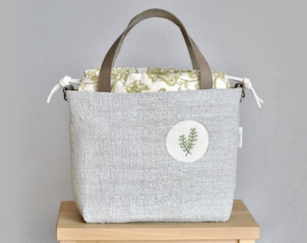 large knitting project bag made of natural linen with hand-embroidered peephole detail, drawstring linen bag vintage, handmade bag