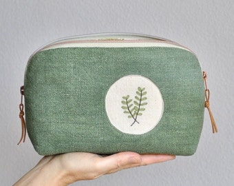 Toiletry bag made of vintage linen with hand-embroidered peephole motif, large cosmetic bag green, zippered pocket with wide opening