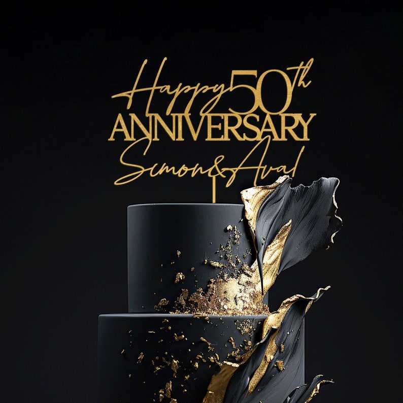May include: Gold cake topper with the text "Happy 50th Anniversary Simon & Ava!" on a black and gold cake.