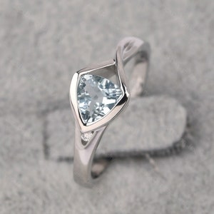 Infinity aquamarine ring trillion cut silver March birthstone minimalist promise ring