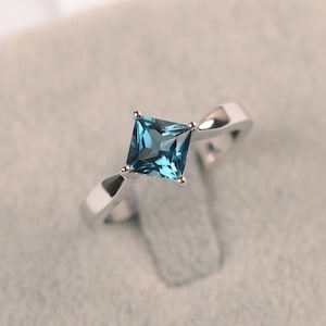 Minimalist ring kite setting London blue topaz wedding ring princess cut November birthstone