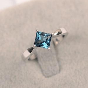 Minimalist ring kite setting London blue topaz wedding ring princess cut November birthstone