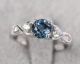 Delicate London blue topaz infinity engagement ring sterling silver round cut twist ring November birthstone