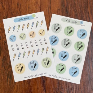 May include: Two sticker sheets with lab tools illustrations. Each sheet features colorful circles with images of beakers, pipettes, and carrots. The text "lab tools" and "©2021" are present. The website address www.MadisonSetoDesign.com is also visible.