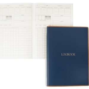 May include: A blue leather-bound logbook with the word "LOGBOOK" embossed in gold on the front cover.