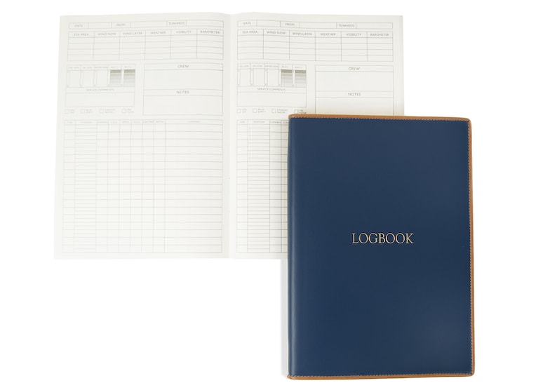 May include: A blue leather-bound logbook with the word "LOGBOOK" embossed in gold on the front cover.