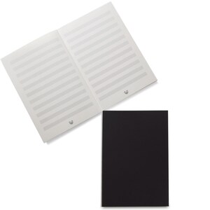 May include: An open music notebook with staff lines, next to a closed black notebook. The music notebook is white with gray lines and silver binding. The black notebook is rectangular and solid black.