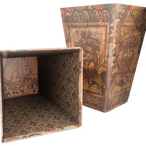May include: Two decorative boxes with a vintage map and floral pattern. The boxes are made of cardboard and have a square and rectangular shape.