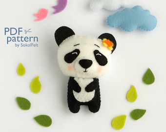 May include: A PDF pattern for sewing a cute panda plushie. The pattern includes a black and white panda with a flower on its ear, surrounded by green leaves and blue clouds.