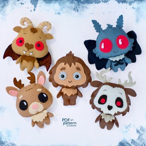 Op de afbeelding: Vijf pluche speelgoedjes van vilt in de vorm van mythische wezens. De speelgoedjes zijn bruin, grijs en beige met rode ogen. De speelgoedjes zijn in een cirkel op een witte achtergrond gerangschikt. De tekst "PDF pattern by SoboFelt" staat onderaan in het midden van de afbeelding.