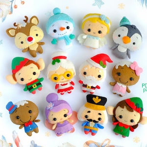 Könnte beinhalten: Ein Set mit 12 Weihnachts-Anhängern aus Filz, die verschiedene Figuren zeigen, darunter einen Schneemann, einen Pinguin, eine Lebkuchenfigur, einen Elf und den Weihnachtsmann. Die Anhänger sind alle handgenäht und haben einen niedlichen, verspielten Stil.