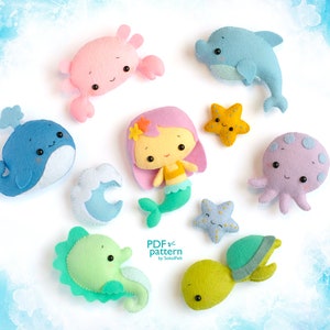 May include: A set of felt ocean animal patterns for sewing. The patterns include a whale, dolphin, crab, mermaid, octopus, seahorse, turtle, and two starfish.