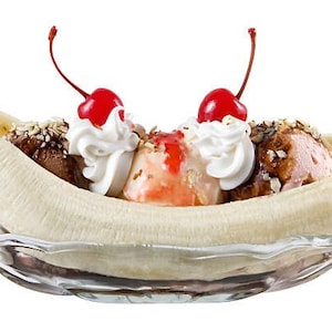 May include: A banana split dessert with three scoops of ice cream, whipped cream, chocolate sauce, nuts, and two maraschino cherries.