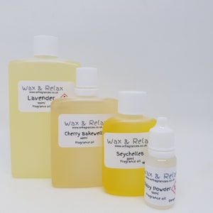 May include: Four bottles of fragrance oil in various sizes. The bottles are labelled with the brand name "Wax & Relax" and the fragrance names "Lavender", "Cherry Bakewell", "Seychelles", and "Baby Powder".