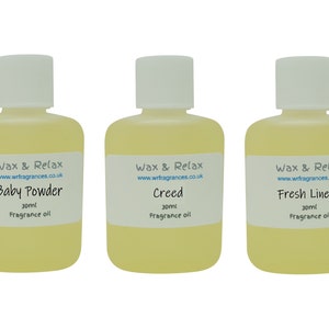 May include: Three 30 ml bottles of fragrance oil with white labels. The labels have the text "Wax & Relax" and a website address. The bottles are labelled "Baby Powder", "Creed", and "Fresh Linen".