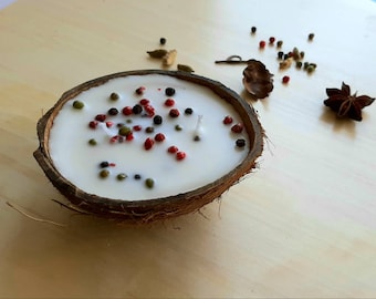 Coconut scented candle decorated with black, green and rose pepper Coconut shell candle