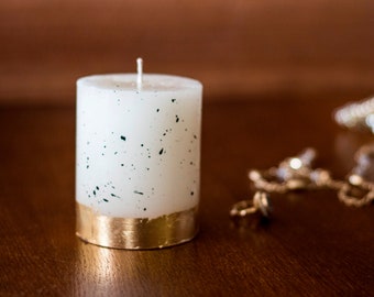 Luxury scented white candle decorated with gold foil