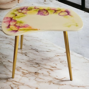 Resin multi colored coffee table in white, green, yellow, violet with metal legs