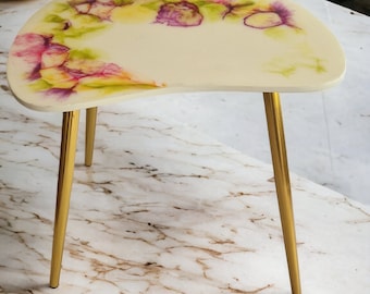 Resin multi colored coffee table in white, green, yellow, violet with metal legs