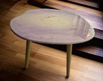 Resin colored coffee table in light violet and white with gold details, marble like table, wooden legs