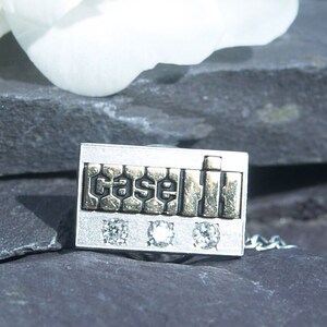 Vintage Jostens 10ct White/Yellow Gold & Diamond &#39;CASE&#39; Employee Pin.