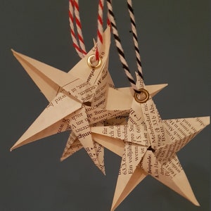 Book folding art: Stars made from old books or sheet music, hand folded and provided with an eyelet for hanging
