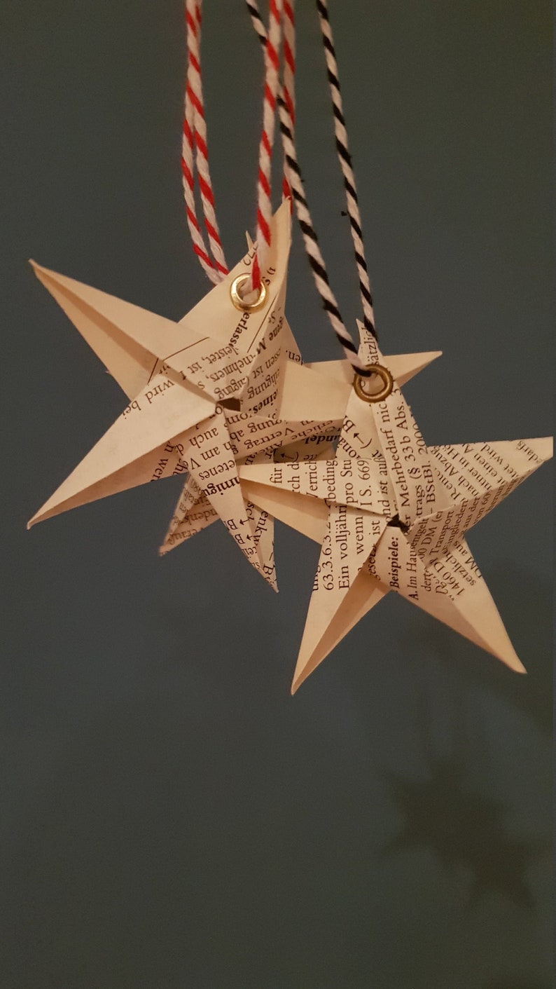 Book folding art: Stars made from old books or sheet music, hand folded and provided with an eyelet for hanging image 1