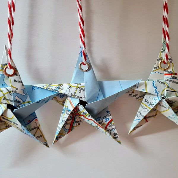 Book folding art: stars made from old road maps, hand folded and provided with an eyelet for hanging