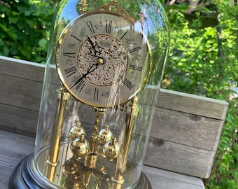 Vintage ZentRa rotating pendulum clock table clock annual clock made of brass with glass insert