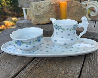 Set of milk and sugar on a plate with floral decoration, white, blue, green marker LM