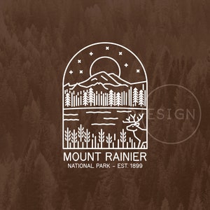 May include: A white line art illustration of a mountain range, a lake, trees, a deer, and a full moon with stars. The text "MOUNT RAINIER NATIONAL PARK - EST. 1899" is below the illustration.