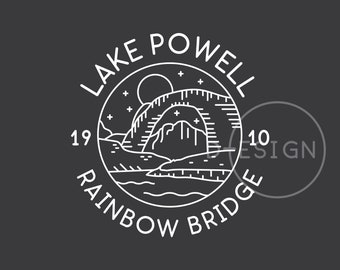 May include: A black and white line art illustration of a scenic view of Rainbow Bridge National Monument in Lake Powell, Utah. The illustration is in a circle with the text "Lake Powell Rainbow Bridge" around the outside.
