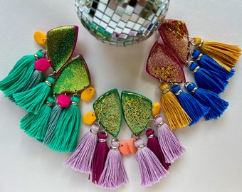 Glittery statement party ear studs with tassels