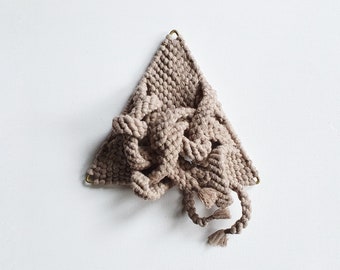 Sand-coloured knotted soft sculpture in triangular frame. “Dreieck”, 2021, 20cm wide by 25cm long. Small macrame wall hanging.