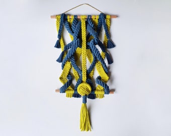 Large interactive macrame art in dark teal and chartreuse
