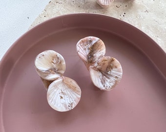 Sculptural pleated petal ear studs in marbled aesthetic